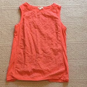A coral colored tanks top.